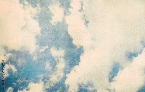 Retro sky photo. Old vintage paper with clouds and sky. © BillionPhotos.com