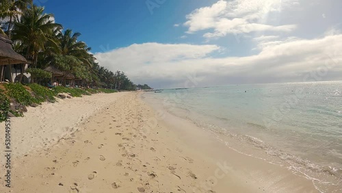 Beach in Mauritius Belle Mare on a parly cloudy day photo