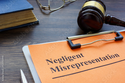 Document about Negligent misrepresentation and a gavel. photo