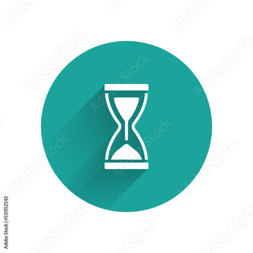 White Old hourglass with flowing sand icon isolated with long shadow. Sand clock sign. Business and time management concept. Green circle button. Vector