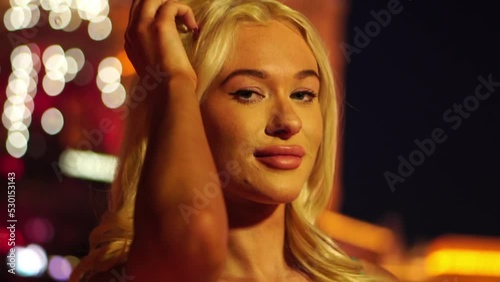 Portrait of Young Blonde Female in Shiny Exterior of Las Vegas Strip, Slowmo