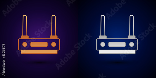 Gold and silver Router and wi-fi signal icon isolated on black background. Wireless ethernet modem router. Computer technology internet. Vector