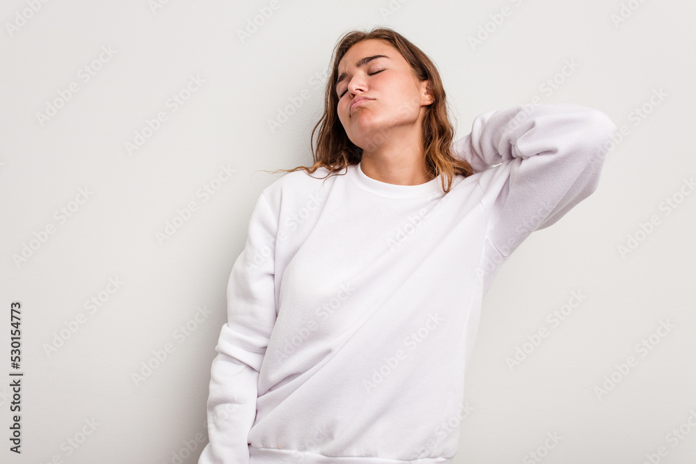 Young caucasian woman isolated on blue background massaging elbow, suffering after a bad movement. Young caucasian woman isolated on blue background massaging elbow, suffering after a bad movement.