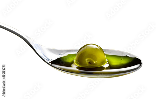 organic olive oil poured into the spoon