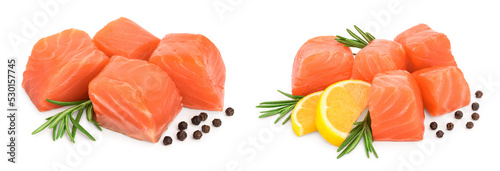 raw salmon piece cube with rosemary and peppercorn isolated on white background close up