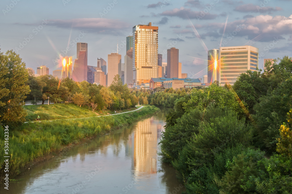 Houston Skyline Reflected in Bayou During Golden Hour with Eight Point Star on Buildings from Sunlight