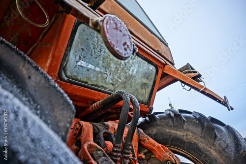 hydraulics of red and old tractor