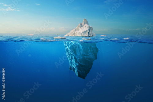 Foto Amazing white iceberg floats in the ocean with a view underwater