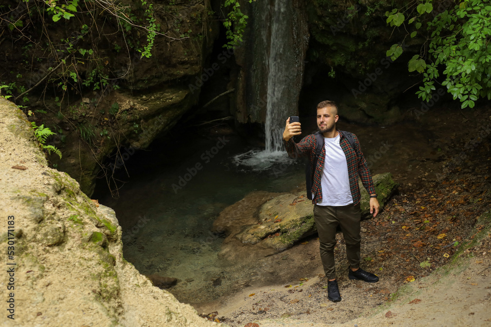 a man in the forest with a phone a man in the forest with a phone
