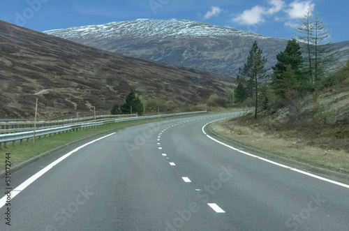 Empty winding road in the Scottish mountains