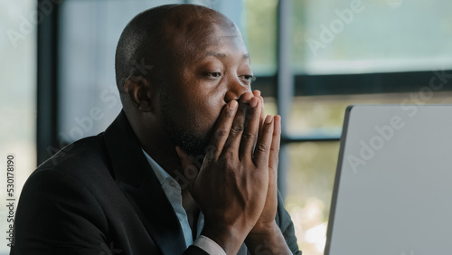 Φωτογραφία Tired stressful african male adult sad businessman feel tiredness discomfort eye