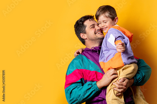 Father with son in 80s vintage sport suits