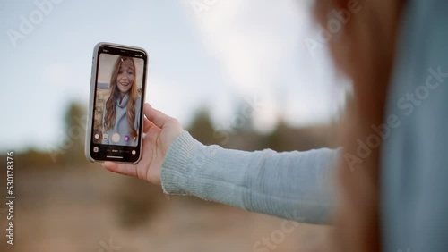 Girl content creator taking selfie video for social media on phone