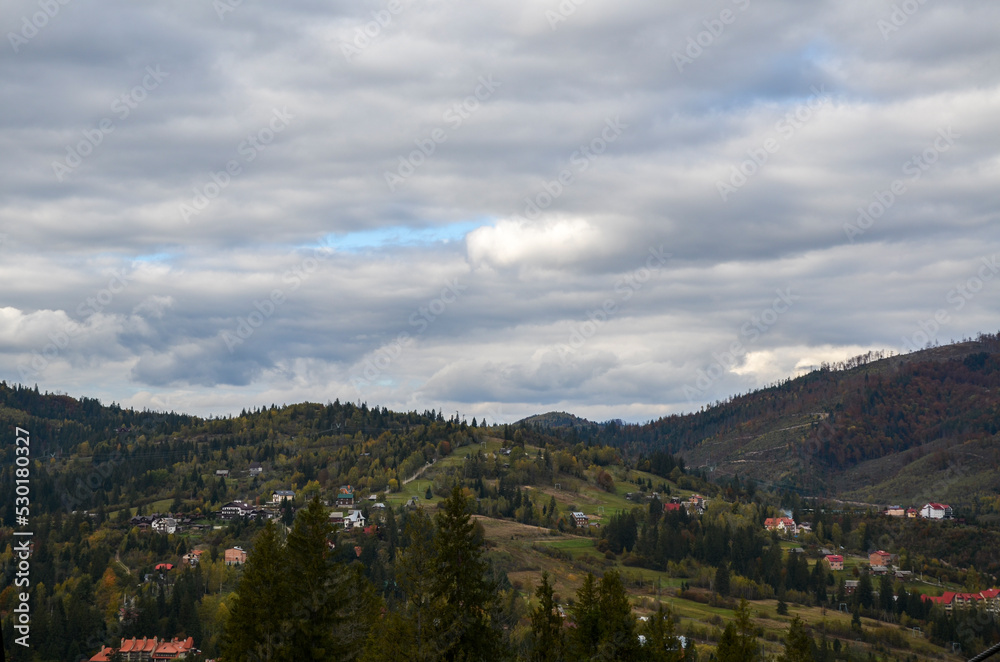 Top view of Carpathian Mountains and village Slavske in autumn season in Ukraine