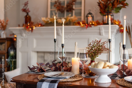 Thanksgiving dinner table decorated for fall