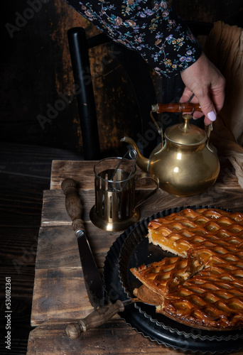 apricot pie with black tea on wooden table seasonal autumn still life