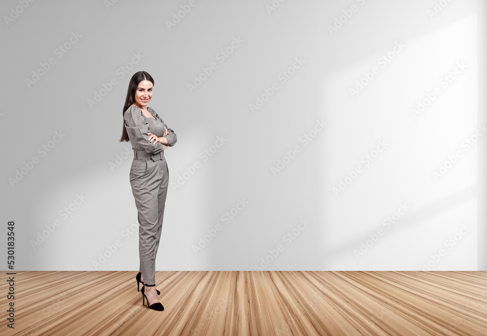 Businesswoman wearing formal wear is standing in crossed arms Businesswoman wearing formal wear is standing in crossed arms