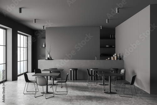 Front view on modern dark cafe interior with four tables