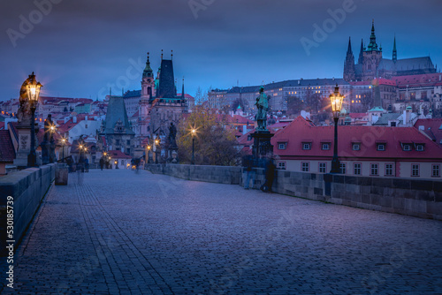 Charles bridge illuminated at dawn, Medieval Prague, Czech Republic