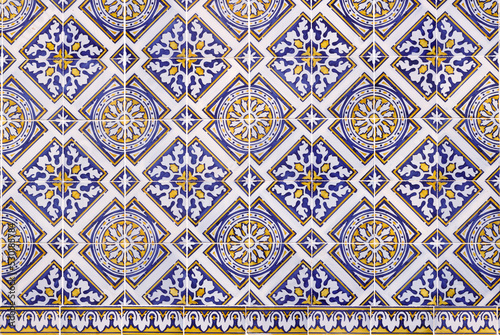 Highly detailed ornamental mosaic of tiles in golden and blue tones