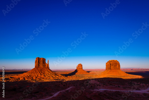 The Mittens, three buttes in Monument Valley at sunrise, Arizona and Utah, USA