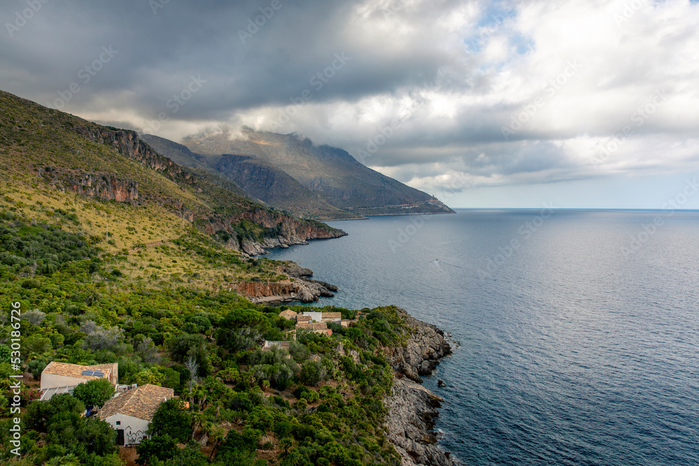 San Vito Lo Capo, Sicily - July 8, 2020: View from the coastal path of the Zingaro Natural Park, between San Vito lo Capo and Scopello, province of Trapani, Sicily, Italy San Vito Lo Capo, Sicily - July 8, 2020: View from the coastal path of the Zingaro Natural Park, between San Vito lo Capo and Scopello, province of Trapani, Sicily, Italy