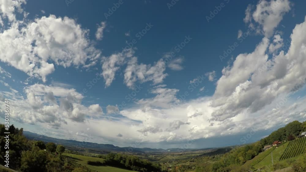 white clouds are floating in the sky, thereby covering the shot at about 300 meters in height, late summer, early afternoon, central Europe, hilly area white clouds are floating in the sky, thereby covering the shot at about 300 meters in height, late summer, early afternoon, central Europe, hilly area