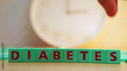 The word DIABETES made of small colorful cubes with letters. Chronic disease, insulin hormone issues. High quality 4k footage photo