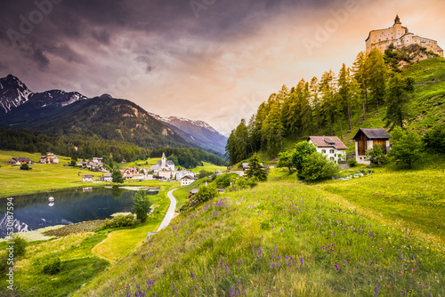 Fototapeta Naklejka Na Ścianę i Meble -  Tarasp with colorful wildflowers and meadows at springtime, Engadine, Swiss Alps