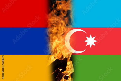 Defocus war. Conflict between Armenia and Azerbaijan over Nagorno-Karabakh. Let's stop the war. Azerbaijan and Armenia conflict. Country flags on flame background. Out of focus photo