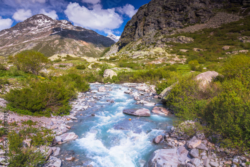 River in idyllic and dramatic landscape of Haute Savoie near Iseran Pass, France