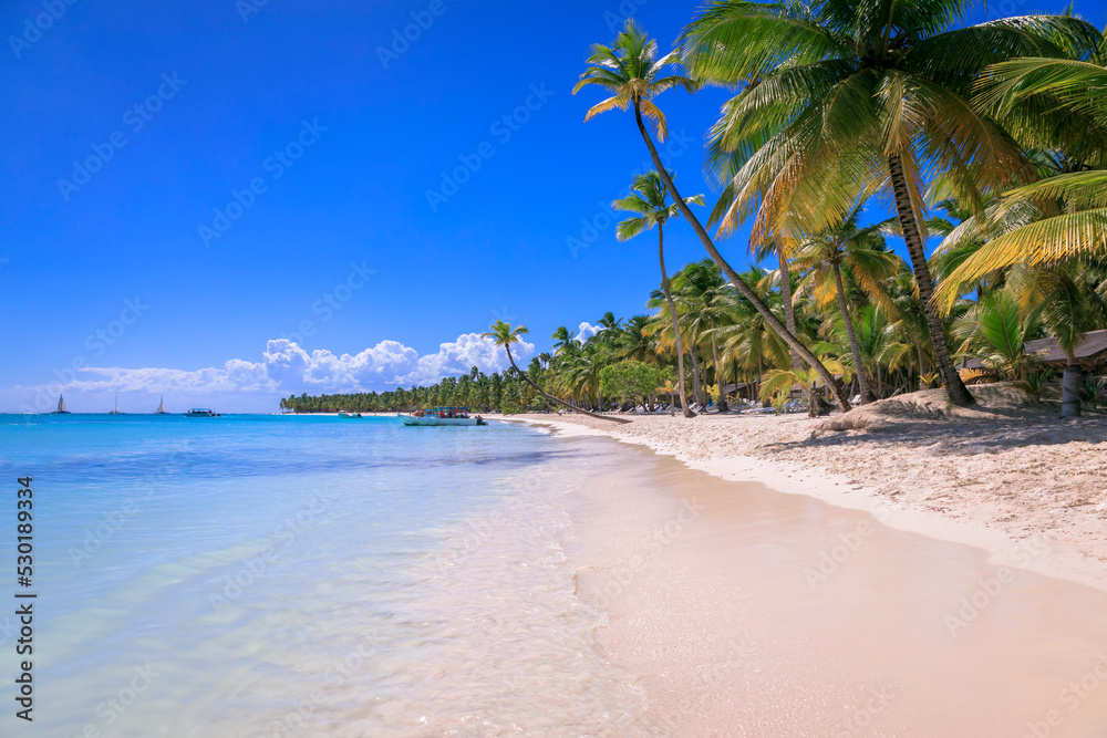 Tropical idyllic caribbean beach with sailboats, Punta Cana, Dominican Republic