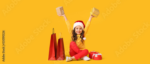 Cute little girl in Santa h...