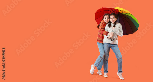 Portrait of cute twin girls...