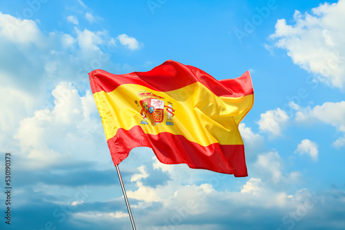 Waving flag of Spain agains...