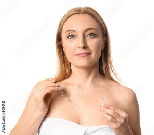 Mature woman with cosmetic ...