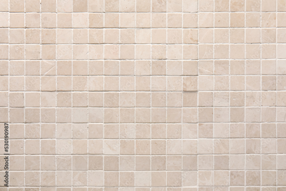 Beige tile wall as background, closeup Beige tile wall as background, closeup