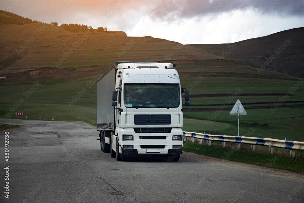 truck driving through the mountains