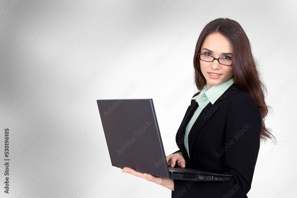 Young smiling student girl with laptop, e-learning at university college concept Young smiling student girl with laptop, e-learning at university college concept