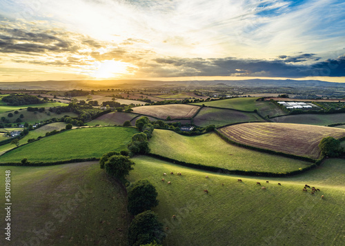 Sunset over Farmlands and Fields from a drone, Devon, England, Europe photo