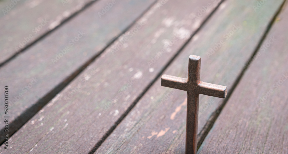 Cross with wood plank background. Good Friday or christianity concept.