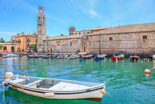 Obraz na płótnie Idyllic lake Garda coastline in Lazise with boat, Northern Italy w salonie