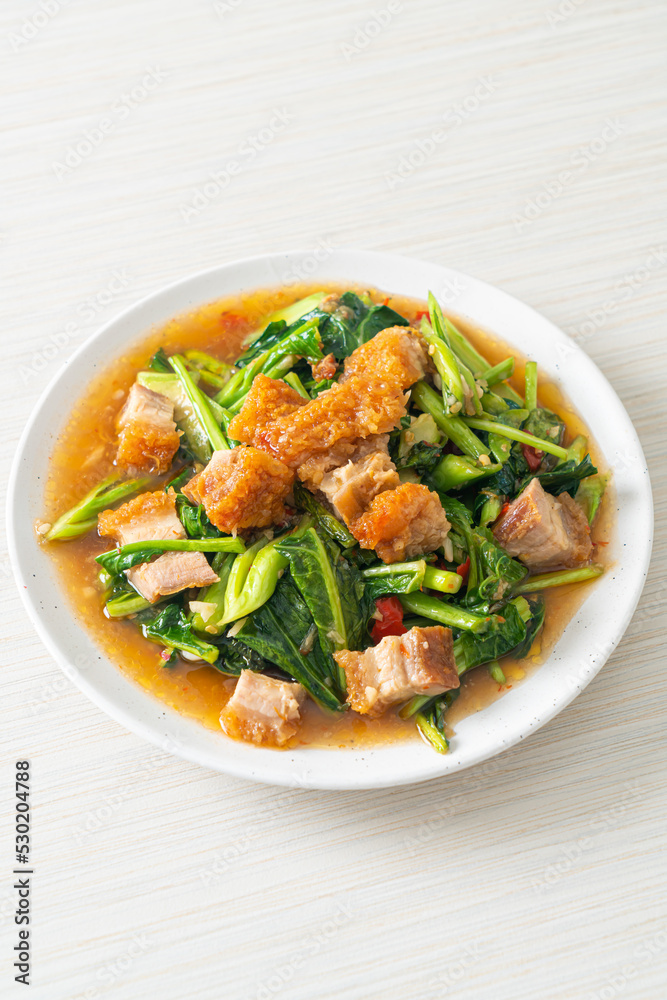 Stir-fried kale vegetable with crispy pork