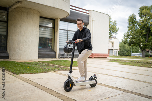 caucasian man drive or ride electric kick scooter e-scooter