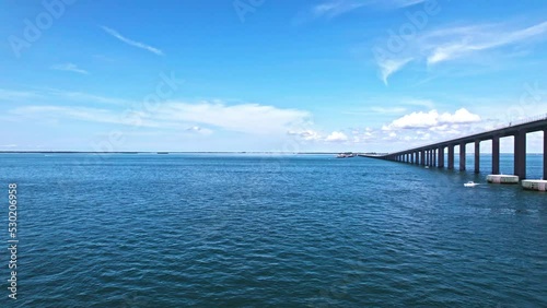 Wallpaper Mural Calm Waters Of Lower Tampa Bay With View Of New Concrete Bridge Sunshine Skyway And Its Structural Dolphins In Florida. wide drone shot Torontodigital.ca