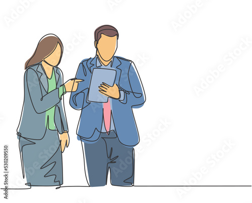 One single line drawing of young male and female employee discussing work while watching annual report graph on tablet phone. Job discussion concept continuous line draw design vector illustration