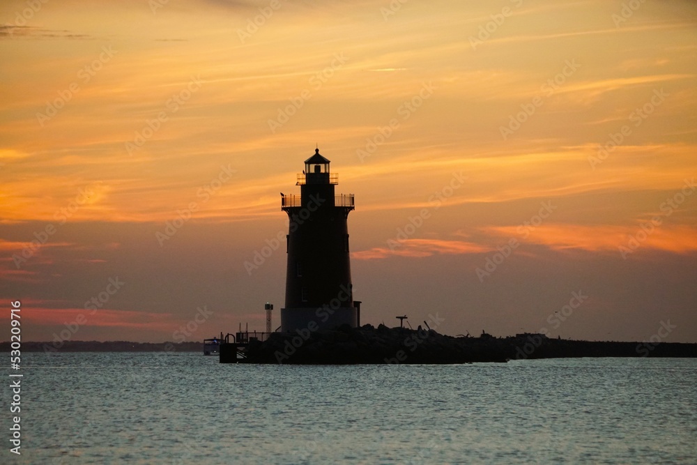 Silhouette of the lighthouse during sunset near Cape Henlopen State Park, Lewes, Delaware, U.S.A