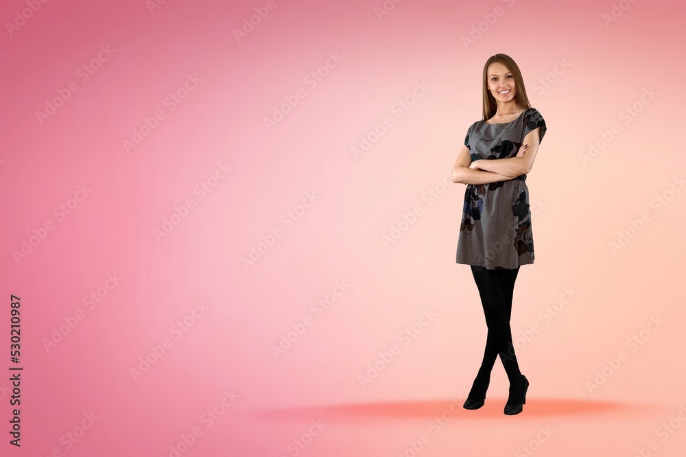 Young smiling pretty woman on pastel background studio portrait