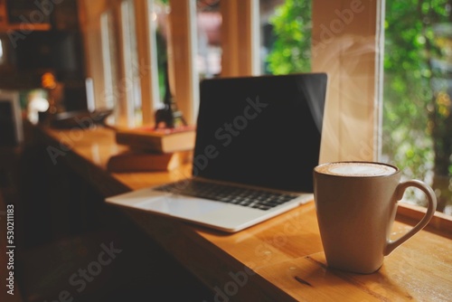 cup of coffee on laptop