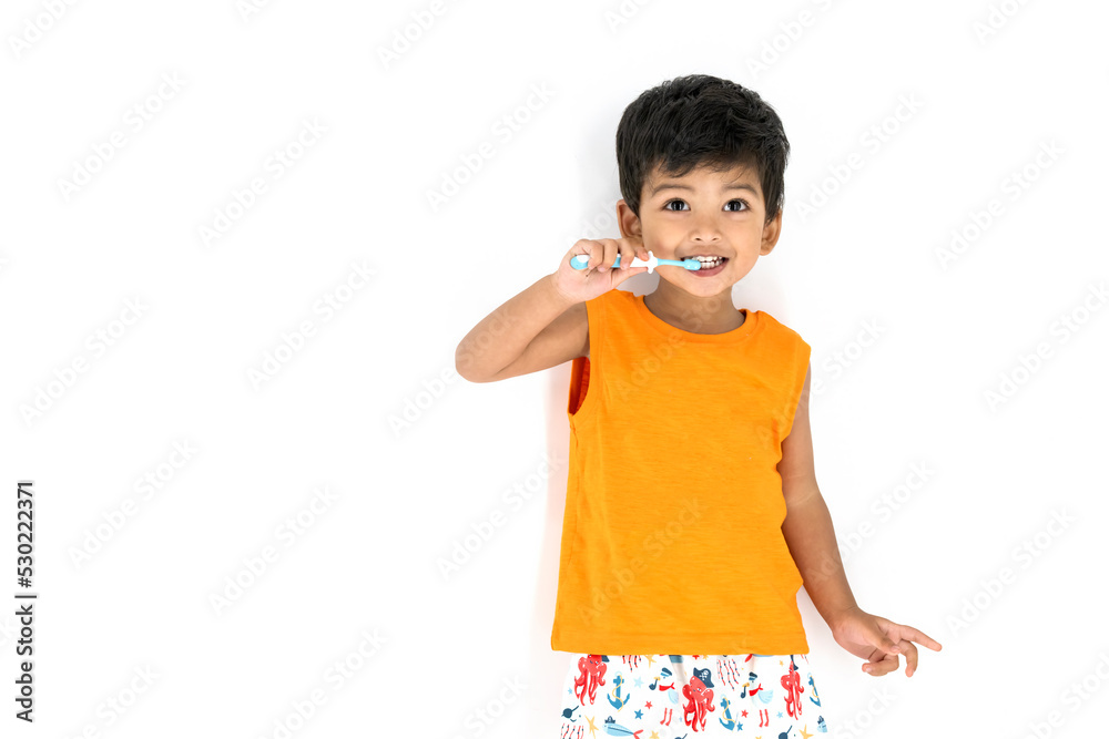 Cute little Kid brushing his teeth smiling very happy and enjoying isolated on white background. Dental Hygiene of little kid medical care. Oral Health awareness for kids and infant concept. Cute little Kid brushing his teeth smiling very happy and enjoying isolated on white background. Dental Hygiene of little kid medical care. Oral Health awareness for kids and infant concept.